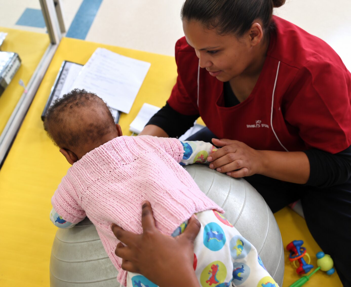 Pediatric therapy session with a baby using an exercise ball in Cape Town