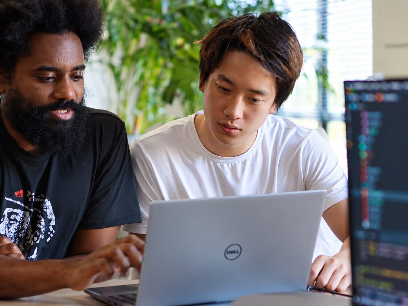 People collaborating on a technology project.