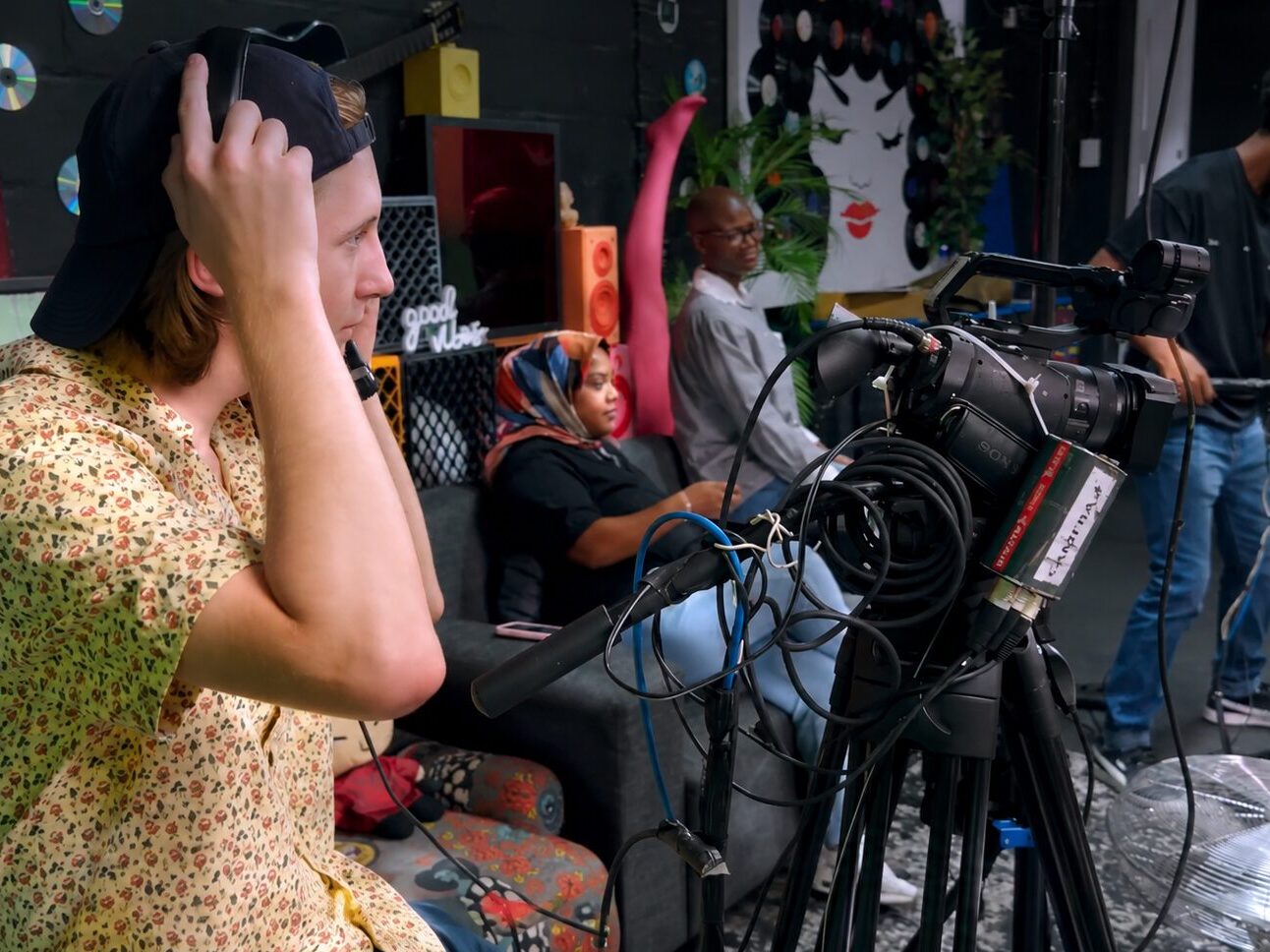 Film production team working with a camera.